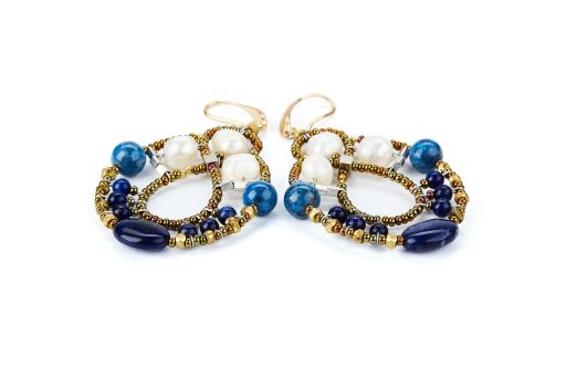 Galaxie chandelier Earrings are done in White Water Pearls & Blue Lapis Gemstones with Blue Zircon accents. Murano Glass Beads on Stainless Steel Wire create the design and shape. Gold plated 925 Sterling Silver Posts. L 2 3/4" X W 1 1/2"