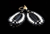 These chandelier Jet Earrings by Ziio are the perfect Black & White combination. A long matte Black Onyx Gemstone is at the center surrounded by the beautiful contrast of White Water Pearls. Beaded on stainless steel wire with Black Murano Glass Beads