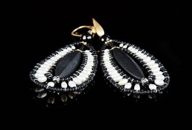 These chandelier Jet Earrings by Ziio are the perfect Black & White combination. A long matte Black Onyx Gemstone is at the center surrounded by the beautiful contrast of White Water Pearls. Beaded on stainless steel wire with Black Murano Glass Beads