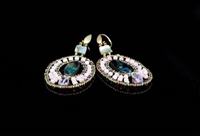 Ziio's oval drop Moonlight Earring comes in various colors. An Abalone at the center is surrounded, in this case, with Pink Stones and an Amethyst Gemstone at the bottom. Murano Glass Beads are used to create the shape. Gold plated Sterling Silver Post