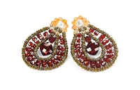 From Ziio's Tabiz Collection, these oval drop Earrings sparkle in Red Zircon Gemstones. A Red Garnet Gemstone drop is at the center. Murano Glass Beads on stainless steel wire create the frame & shape. 925 Sterling Silver Posts. Made in Italy