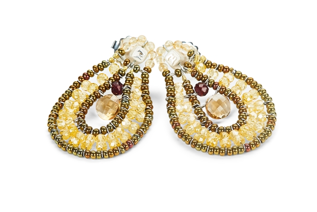 From Ziio's Tabiz Collection, these oval drop Earrings sparkle in Yellow Zircon Gemstones. A small Citrine drop is at the center. Murano Glass Beads on stainless steel wire create the frame & shape. 925 Sterling Silver Posts. Length 1 1/2" X width 1"