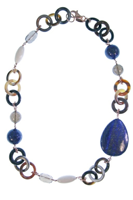 Natural tan & brown Horn Necklace by Amle. Asymmetrical in design, the collar Necklace is accented with Blue Lapis, Smokey Quartz & White Agate Gemstones in various shapes and sizes. Hand crafted in Italy in Rose Gold plated sterling silver chain & clasp