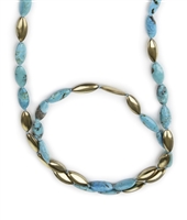 A perfect Necklace for the Turquoise lover in you. Long Turquoise Gemstone Necklace alternates with brushed Gold plated Sterling Beads in the same shape & size as the Gemstones. Wear long or doubled. Made in Italy by Anticoa. Length 42", width 10mm.