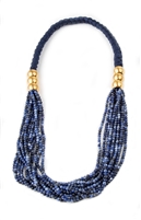 A wonderful Blue Sodalite Statement Necklace by Anticoa. Multi-strands of Sodalite Gemstones are held at the sides with brushed Gold Plated clasps. The neckband is braided navy silk cord. Wear it long or asymmetrical. Fits over the Head. Made in Italy.