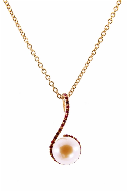 Simplicity is the essence of beauty and this soft Pink Cultured Pearl and Ruby Gemstone Pendant is a good example. Reminiscent in design to a D Clef Note, the Pearl (9mm) is enhanced & framed by 0.18ctw of sparkling Red Rubies. Done in 18k Yellow Gold.