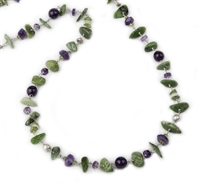 The irregular Gemstone shapes and mix of color give this Necklace it's unique appeal. Green Serpentine stone Beads complimented by the Purple Amethyst Gemstones. 925 Sterling Silver chain & slide clasp. Length 36". Stones vary from 3/8" to 1" in width