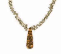 Tiny seed beads of Smokey Quartz Gemstones fill the Gold filled chain and hold a triangular Pendant of Petrified Coral. Made in the U.S. by Elisa Ilana. Adjustable in length from 16" to 18". Coral Pendant length 1 3/4"