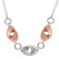 The movement & depth in this two-tone Cyclone Twist Necklace is amazing. Done in 925 Sterling Silver, accented with Rose Gold plating and laser cutting. Lobster Clasp. Double chain at the Neck. Length 18" to 20" adjustable.