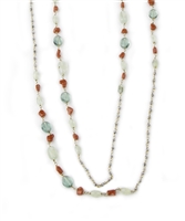 Extra long Beaded Necklace can be worn multiple ways. Filled with soft Green Fluorite & Moonstone Gemstones that accented with the red of Coral Beads. The Sterling Silver chain is accented with small Pyrite Beads for a hint of sparkle.  Length 76 inches