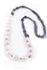 Rajola's long Forever Necklace in large,White Baroque Pearls & Hematite. The multi-strands of Hematite add sparkle & a unique touch to a classic look. 36" long. can also be worn asymmetrically for a different look. Pearls are aprox. 19mm. Made in Italy.