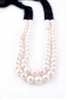 This designer Necklace by Rajola is one you will wear for many years. The large, double strand of White Pearls have a unique look with faceted Black Onyx Gemstones that have been woven into a band and attached on an 18k Gold Bar. No clasp. Length 32"