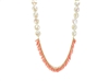 Unique in design, this limited edition Coral & Pearl Necklace is by Silver Pansy. Peach Coral Beads are fringed in the front with large White Freshwater Coin Pearls (13-14mm) accenting the sides. Gold Filled chain and clasp. Made in the U.S. Length 19"