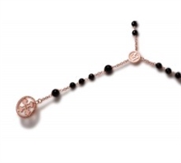 Tuum's Rosario Necklace is a tribute to the symbolic and aesthetic beauty of the "Rosarium". The chain & Medallions are in Rose Gold plated Sterling Silver, Black Onyx Gemstones create the Rosary and Tuum's Flor is the main detail of the lower part