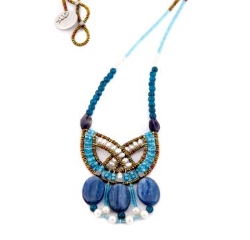 this statement Pendant Necklace in various shades of Blue is sure to get noticed. Blue Kyanite, Zircon, Apatite & Iolite Gemstones compliment each other. Accented with White Water Pearls and Murano Glass Seed Beads on Stainless Steel wire. Made in Italy