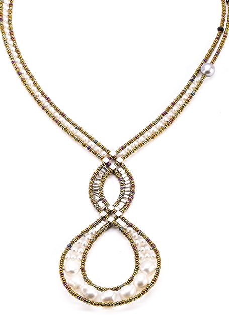 Ziio's Infinity Necklace features an open, Intertwining design & asymmetrical neck band. This one is done in White Water Pearls with Black Tourmaline & Silver Beads as accents. Beaded on stainless steel wire with Murano Glass seed Beads. Made in Italy
