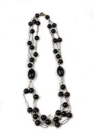 A beautiful, long, Black Onyx Bead Necklace in Rose Gold plated 925 Sterling Silver. Three strands of round Onyx Beads (aprox. 12mm) on an open link chain are connected on both sides by a large cylindrical Black Onyx Bead (aprox 1 1/4" L). Length 28"