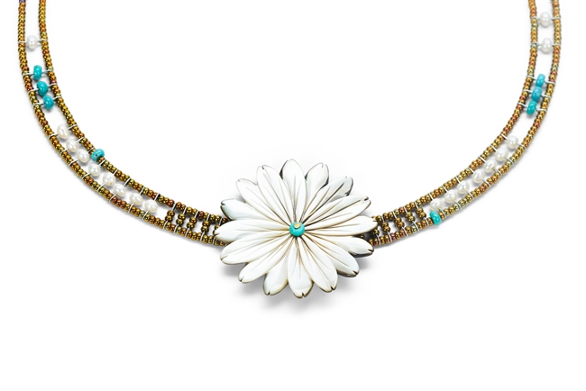 Hand cut Mother of Pearl Flower is the focus of Necklace by Ziio. Accented with Turquoise Beads & White Seed Pearls framed by Murano Glass Beads. Sterling Silver Button Closure, adjustable length 16" to 19". Flower 2"diameter. Hand crafted in Italy