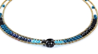 Ziio's thin Giro Necklace in various hues of Blue Gemstones - Lapis, Iolite, Blue Zircon & Black Tourmaline. A great beaded piece to add a subtle touch of color. Hand crafted in Italy on Stainless Steel wire with Murano Glass Seed Beads