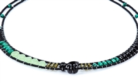 Ziio's thin Giro Necklace in various hues of Green Gemstones - Malachite, Chrysoprase, Green Zircon & Black Tourmaline. A great beaded piece to add a subtle touch of color. Hand crafted in Italy on Stainless Steel wire with Murano Glass Seed Beads.