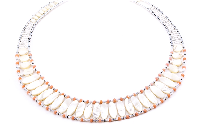 This Mother of Pearl Necklace is an Italian twist on your classic Pearl Necklace. Hand crafted in Italy by Ziio, it features a graduating band of polished, White Mother of Pearl beads, accented with soft pink Coral Beads. On stainless steel wire