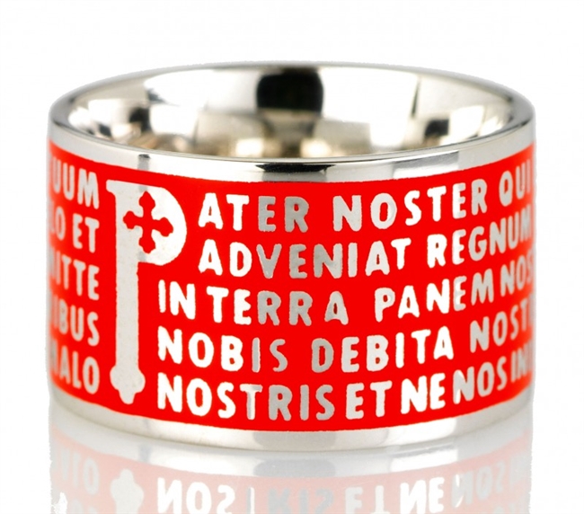 The Animae collection by Tuum is the Sterling Silver rhodium plated version of their ring creations. This is the "Pater" with the Pater Noster (Our Father) Latin text written in relief in over five lines. Crafted in 925 Sterling with red enamel overlay