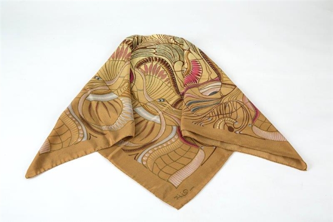 Ziio's Jungle Print Silk Scarf in Beige. 36" Square in Silk Crepe. A beautiful pattern in Beige, Tan, Pink and Cream with shades of Blue. Made in Italy with a hand rolled finished edge.