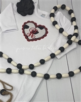 Glitter and cowprint double heart with initial on a ruffle baby gown