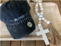 Black distressed pony tail hat with white embroidery font