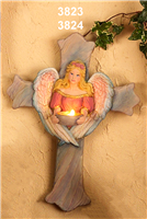 A flat cross of cast ceramic textured like stone. The tips of each arm are scalloped into three points, and there is the figure of an angel raised in the center. The wings wrap around the angel and meet at its waist. Its outstretched hands hold a candle.