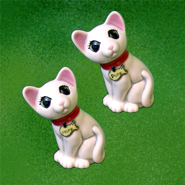 Two small cast ceramic cats. They are identical. Both are seated, looking slightly upward and to their left. They have large triangular ears and their tails curl up around their sides. They wear collars with fish shaped tags and have wide eyes.
