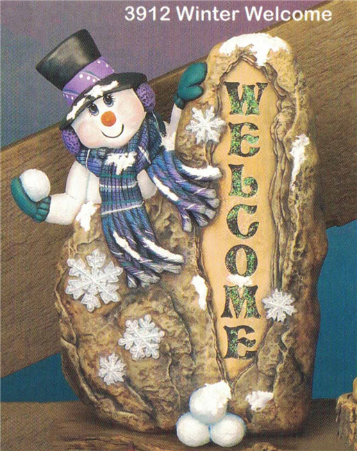 A cast ceramic statue of a snowman hiding behind a large rock. The snowman holds a snowball in its gloved hand and looks up mischievously. The word Welcome has been carved into the side of the rock, and there is a pile of snowballs in front of it.