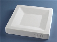A white plaster mold for pressing moist clay into shapes on a blue background. It is square in shape, with a smaller square carved into the center surrounded by angled edges.