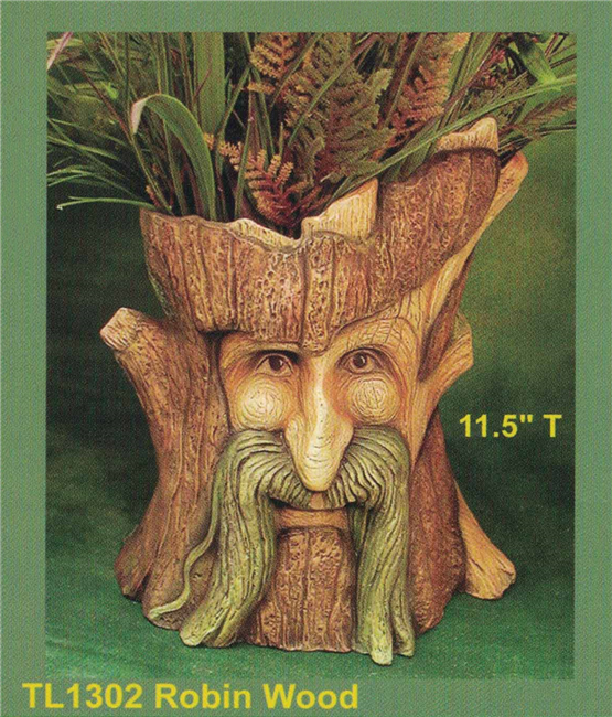 A cast ceramic figure of a tree trunk with a stylized face, similar to an ent. The face looks up mischievously with a raised brow. A section of trunk gives the appearance of a long mustache. The top of the trunk is hollowed out into a planter.