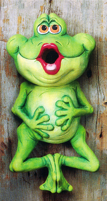 A cast ceramic figure of a cartoonish frog made of multiple pieces. It hangs, legs bent below it with feet pressed together, hands on its stomach. It looks forward, lips pursed and open. The open lips serve as an opening for the head, which is hollow.