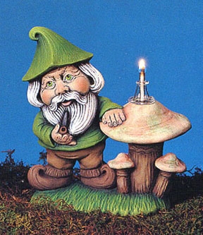 A cast ceramic figure of a cartoonish gnome standing next to a group of mushrooms. The gnome has a round face with long facial hair. He holds a pipe, and stands with a hand resting on the mushrooms. The tallest mushroom is hollow and holds a lit wick.