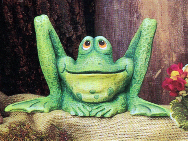 A cast ceramic figure of a seated cartoonishly styled frog with exaggeratedly long hind legs. The knees of its bent back legs come up well above its head. It looks upward with a slight smile on its rounded face.