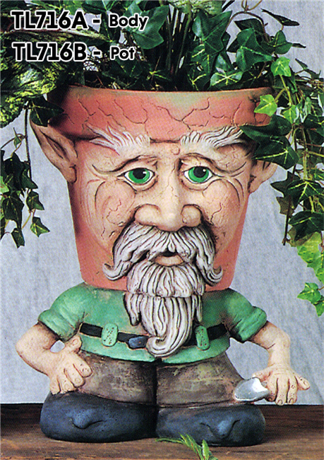 A cast ceramic pot with a cartoonish gnome face. The face has long facial hair and two pointed ears on either side of the pot. It is placed on a separate standing cast ceramic body with wide legs and feet and a small trowel in one hand.