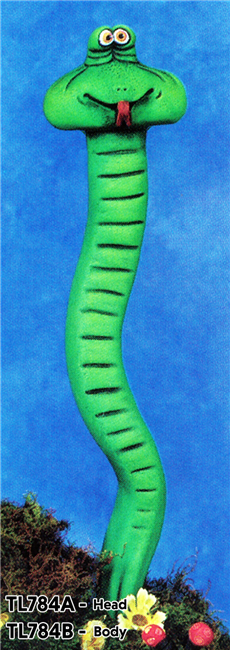 A two part cast ceramic figure of a cartoonishly styled snake. It is stretched out upwards with the point of its tail planted in some greenery.  Its long body has a few small curves, and its wide head has close set eyes. It sticks its tongue out playfully