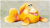 A cast ceramic figure of a cartoonishly styled fish with a humorous expression. It gazes upwards with its tongue sticking out. It is posed with its tail slightly to one side and its pectoral fins in front of it, flat against the ground.