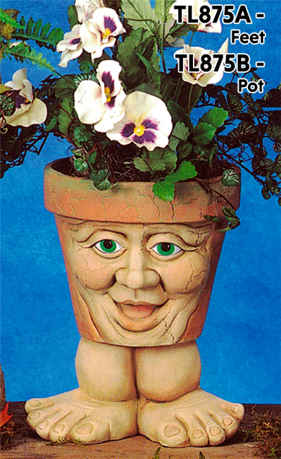 A cast ceramic pot with a cartoonish human face. The face has an open mouth smile, large nose, lidded eyes, and round cheeks. The pot is textured with small lines like aged cracks and is placed atop a pair of wide cartoonish cast ceramic feet.