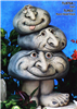 A cast ceramic statue of three stacked rocks atop a pair of legs, each with a cartoonish human face with large nose. The largest bottom rock looks forward with a smile. The middle rock looks to the side with a grin. The top rock looks forward, tongue out.
