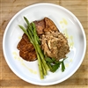 Savory pulled BBQ chicken over sliced sweet potatoes.  Served with garlic asparagus.