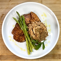 Savory pulled BBQ chicken over sliced sweet potatoes.  Served with garlic asparagus.