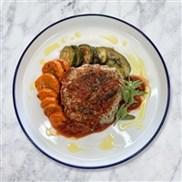 Seasoned lean ground turkey mixed with fresh basil and seasonings and formed into a patty.  Grilled then served bunless with roasted carrots and zucchini.