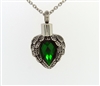 Angel Wings Wrapped Around Emerald Colored Stone
