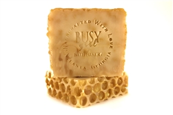 organic honey soap for sensitive skin with colloidal oatmeal and a unisex fragrance that smells like toffee and caramel