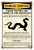 Ogopogo Public Notice Vintage Metal Sign. Measures 12 inches by 18 inches and weighs in at 2 lbs. This Metal Sign is hand made in the USA using heavy gauge American steel.