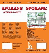 Detailed city map showing highways, street names, recreation trails, informative icons such as schools and parks etc.  A Spokane County map and Spokane and Vicinity map  is included.  Also several insets of districts within the county are shown.