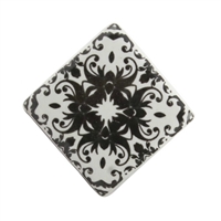 Square black and white ceramic cabinet knob with a floral motif.